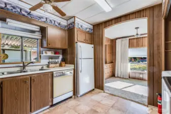 Well-kept kitchen with classic cabinetry and easy-care flooring, designed for comfort and convenience.