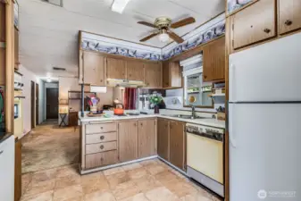 Spacious kitchen layout with plenty of counter space for meal prep or sharing coffee with friends.