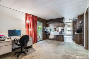 Versatile den or office area provides a comfortable space for reading, crafts, or quiet relaxation.