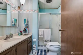 Primary bath features a walk-in shower for comfort and easy accessibility.