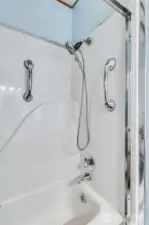 Step-in shower with shower wand & grab bars adds safety and peace of mind.