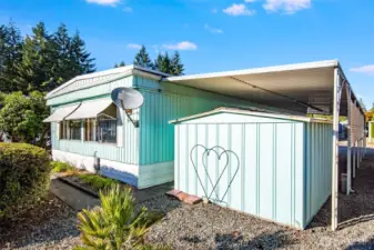 Back exterior view highlights the home’s tidy appearance and easy-care yard.