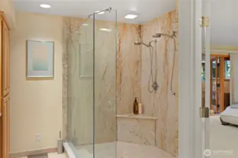 Double headed glass enclosed shower.