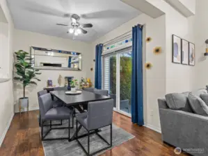 On the other side of the kitchen is the dining room with sliding glass door to the patio space.
