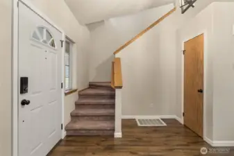 Open stairs to bedrooms and additional bathrooms