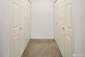 Custom closet system by Closet by Design in primary bedroom