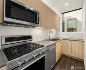 Bright kitchen with window framing the sink.