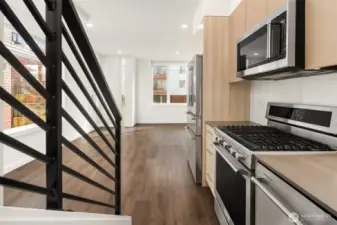 Kitchen flowing seamlessly into main living space.