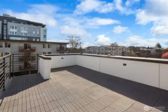 Rooftop deck with distant mountain views.