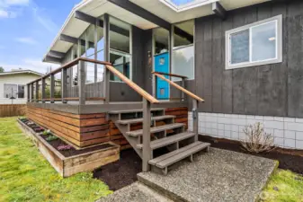 Stylish front steps & deck welcome you to the front porch.