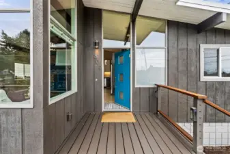 Covered front porch protects you & your guests in any weather.