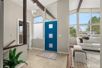 Step through the front door and WOW! Soaring ceilings, open beams and spaces flooded with natural light! No worries - all those windows were replaced in the past 10 yrs with efficient dual panes, so you can fully enjoy those views! Doorway at left leads to office.