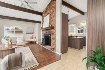The view from inside the front door: huge living room to the left and kitchen just beyond. Office and stairs to lower level are to the right just beyond the edge of the photo.