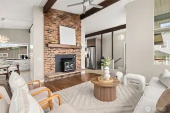 Guests won't want to leave this space! Don't miss the antique collectible Fisher wood burning insert! The orig chimney has been completely rebuilt and new stainless liner meets code; ceiling fan helps circulate the cozy heat throughout the main level. (Don't worry, home also has gas forced air heat if that's your preference.)