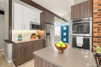 Huntwood cabinets, full height tile backsplash, sparkling quartz countertops, under cabinet lighting and stainless appliances - you are cooking with style here!