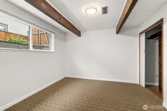 One of 2 lower level bedrooms - beside the closet just beyond the right edge of the photo is a built-in desk area.