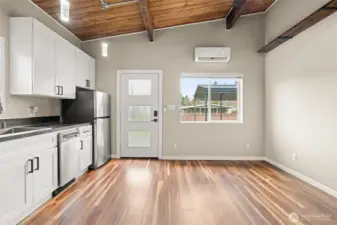 ADU great room area - plenty of room for sofa & small dining table. Note the same beautiful vaults and beams as you see in the main home.