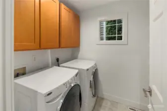 Walk-in laundry room w/ pantry.