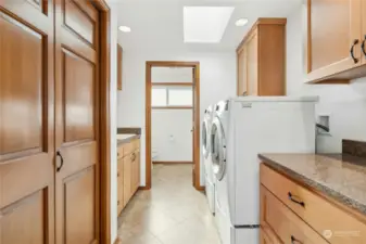 Laundry Room with Front Loaders, wash sink, abundant storage and an attached 3/4 bath right as you enter from the garage.