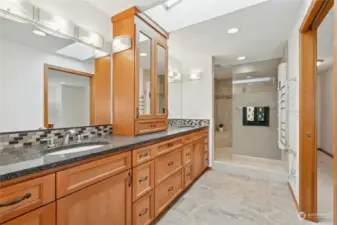 Primary Bath with Dual Vanities, Water Closet, Large Shower, Heated Towel Rack, and Body air dryer.