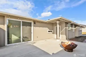 This charming courtyard patio is a private outdoor oasis, designed for both relaxation and entertaining. The space feels intimate and secluded, creating the perfect retreat from the outside world