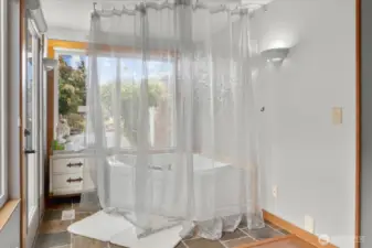 Primary Jacuzzi Bath Behind Curtain