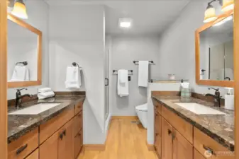 Primary Updated Bathroom with 2 Sinks and a Shower.