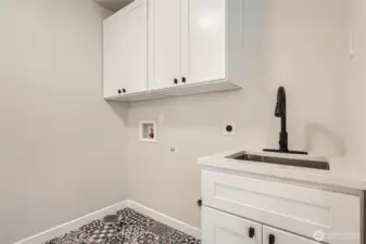 Laundry on Main with laundry sink and fabulous pantry.