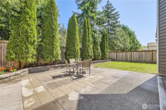Beautiful stone patio with adjacent trex deck, plus ample yard space AND fully fenced.