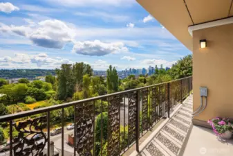 Large deck expanding the length of the entire unit. Looks towards downtown and Mt. Rainier