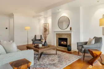 Lovely crown molding and wood trimmed mantle of the gas fireplace showcase the quality construction.