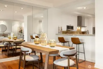 A bartop for guests to visit with the chef, as well as formal dining space. Dining room easily holds much larger table.