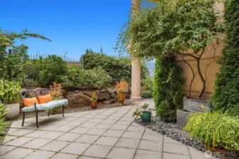 Right outside the west facing Primary, this patio boasts mature landscape and a water feature.