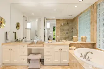 Granite topped double vanities and gorgeous tile surround tub suggests a full Spa experience.