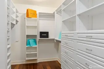 Custom closet system makes beautiful work of managing the entire wardrobe.