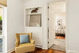 Built in storage and entrance to the shared, continental bath.