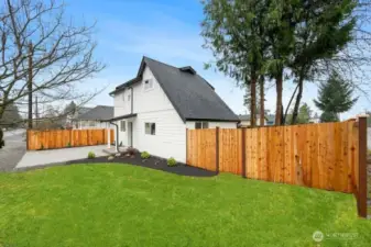 New cement planked siding, new roof, large fully fenced backyard.  Front & backyard will be seeded for lush grass. In this picture the grass is photoshopped