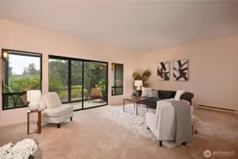 The living room opens into an eastward facing sunroom.