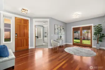 Private office off of entry. French doors to the fenced back yard and patio.