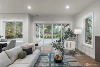 View thru the great room into the large back yard and patio