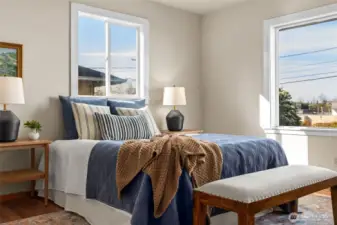 Primary bedroom has nice view out to front of house