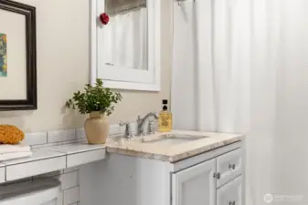 Main bathroom has updated classic tile