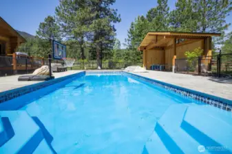 Private pool area with surrounding patio and recreation space—perfect for summer enjoyment and entertaining.