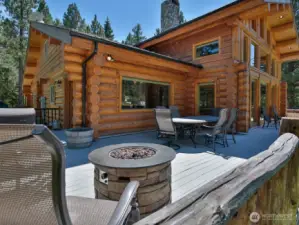 Expansive deck with fire feature and dining area—perfect for outdoor entertaining with direct access to the great room.