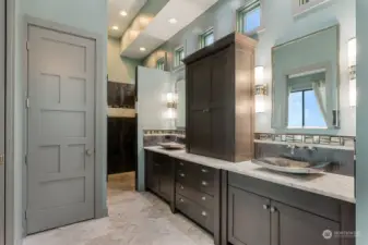 Gorgeous primary bath w/Carrera marble and heated floors. Large walk in shower, hammered Nickel sinks and Victoria & Albert Limestone freestanding tub
