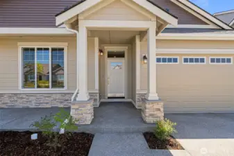 A stately front porch greets you as you enter the home.
