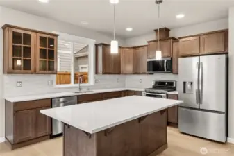 Quartz counters throughout the home. Look at that awesome island, perfect for prepping and entertaining