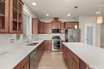 Sable-stained maple cabinets throughout home. Double oven is standard as well as microwave and dishwasher. This home also includes a refrigerator!