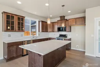 Quartz counters throughout the home. Look at that awesome island, perfect for prepping and entertaining