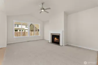 great room with vaulted ceilings, gas fireplace and ceiling fan